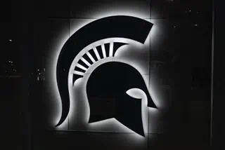Black and white image of the MSU Spartan helmet