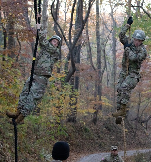 Cadets climbing up hanging ropes