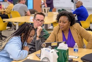 A student receives assistance during the study night that the Transfer Student Success Center partnered with the College of Social Science to host. It was on April 26 at the STEM Teaching and Learning Facility at Michigan State University..