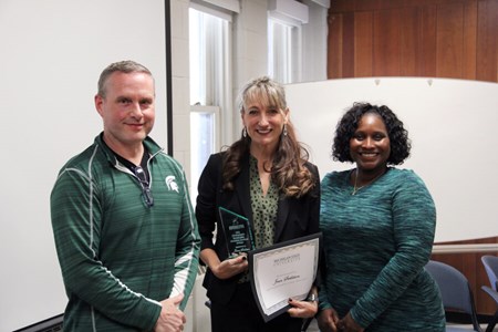 Jeane Stebleton, recipient of the 2022 Outstanding Established Advisor Award, poses for a photo with her nominator, Michael Everett, and Assistant Dean for University Advising Ebony Green, at Michigan State University..