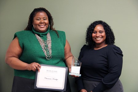 Chamara Kwakye, recipient of the 2022 Outstanding New Advisor Award, poses for a photo with Assistant Dean for University Advising Ebony Green at Michigan State University.