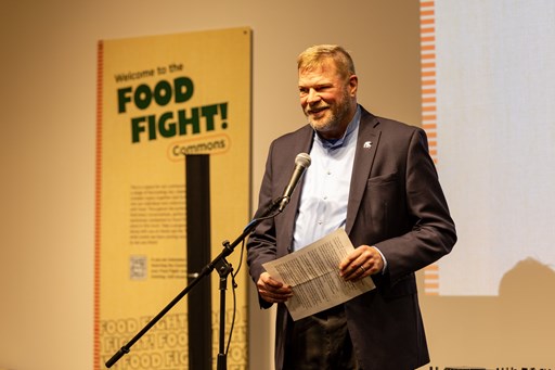 MSU's interim provost Thomas Jeitschko on stage providing remarks at the Food Fight opening